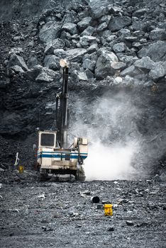 Machine drilling holes  in Limestone Quarry