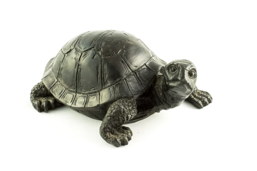 black tortoise souvenir on a white background