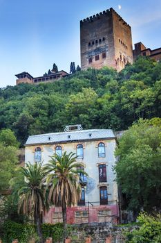 Alhambra Tower Moon from Walking Street Del Darro Albaicin Granada Andalusia Spain  