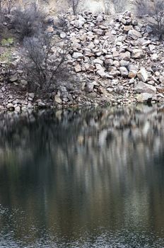 Black water of lake in old quarry 