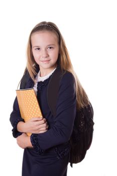 Smiling schoolgirl in uniform and with bag isolated on white