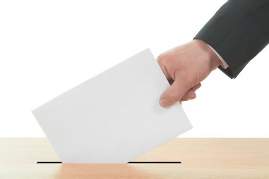 Man's hand down the ballot in the ballot box. Isolated on white