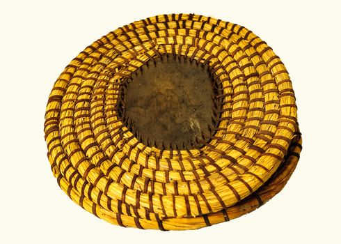 The traditional table mats nade up of grass fibers and tree back in Tanzania.