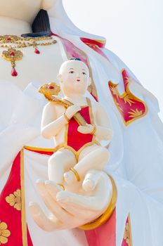 The Guan Yin Buddha Statue child in hand