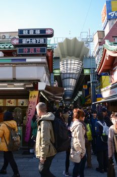 TOKYO, JAPAN - NOV 21 : Nakamise shopping street in Asakusa, Tokyo on 21 November 2013. The busy arcade connects Senso-ji Temple to it's outer gate Kaminarimon