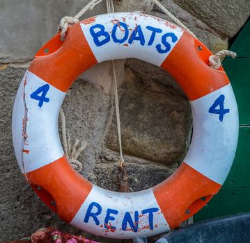 Tourism Image Of A Rustic Boats For Rent Sign On A Lifebuoy