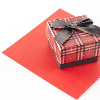 red enveloper and scotch gift box isolated on white background