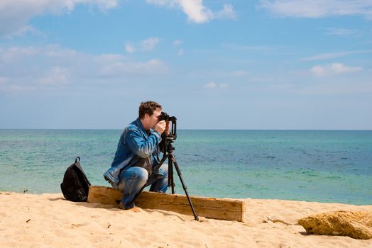 photographer takes pictures panorama of the sea seaside