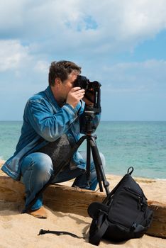 photographer takes pictures panorama of the sea seaside