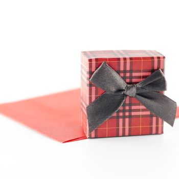 red enveloper and scotch gift box isolated on white background