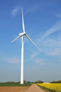 wind turbine standing in field