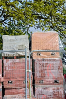 Piles of bricks on construction site