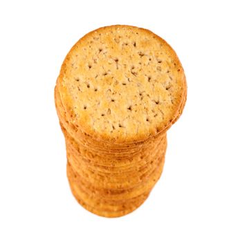 Stack of saltine crackers, top view. Shallow depth of field, isolation on white