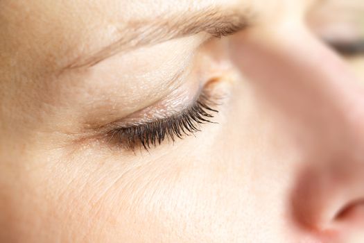 shoot of beautiful middle age woman closed eye macro