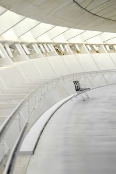 single chair in a sparse modern interior