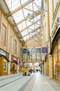 PORTSMOUTH, UK - FEBRUARY  1, 2012: Quiet, post-christmas shopping at Gunwharfs Quay mall in Portsmouth, UK