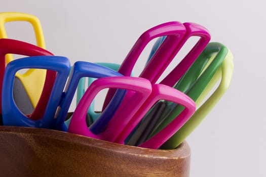 Scissors for decorative works in a wooden container.