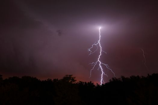 Lightning strikes from the evening sky