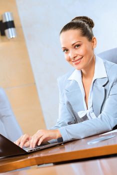 image of a successful business woman, working with laptop