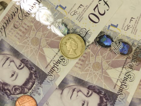 LONDON, CIRCA APRIL 2014: British Sterling Pounds (GBP) banknotes and coins bearing the portrait of Queen Elizabeth II