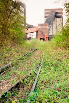 Overgrown railway access to shut down underground coal mine in Essen, Germany, Europe