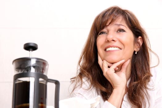 A beautiful mature woman with some Coffee.