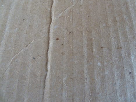 Old brown corrugated cardboard surface with lines