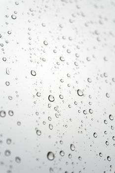 Drops of rain on the inclined window. Shallow DOF