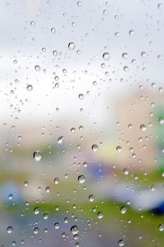 On a autumn raining day. Drops of water on the window. Shallow DOF