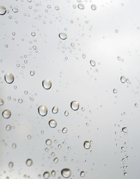Drops of rain on the inclined window. Shallow DOF