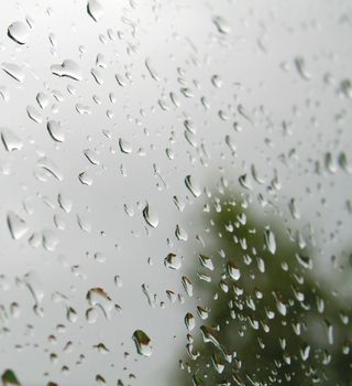 Drops of rain on the inclined window. Shallow DOF