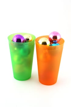 Color christmas decorations (balls) in cups