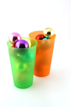 Color christmas decorations (balls) in cups