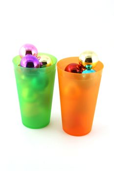 Color christmas decorations (balls) in cups