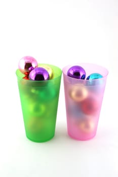 Color christmas decorations (balls) in cups