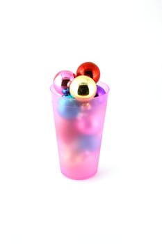 Color christmas decorations (balls) in cup