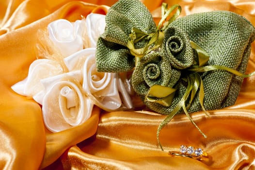  wedding rings on  a colorful fabric background