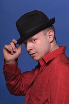 Portrait of man with glasses on blue background