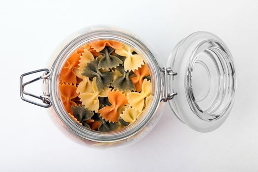 Pasta in a jar on white background. Top view