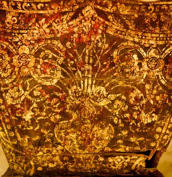 detail of traditional thai pattern that made by stitched gold leaf on wood plate,shallow focus