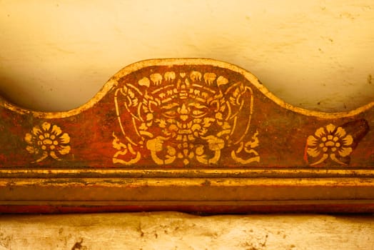 the detail of  thai gold painting pattern on ancient  wood plate,shallow focus,Lampang temple,Thailand