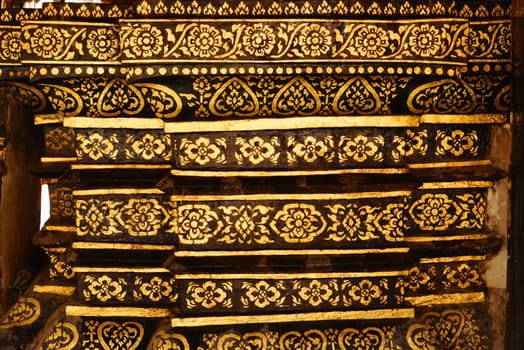 the detail of  thai gold painting pattern on ancient  temple building,shallow focus,Lampang temple,Thailand