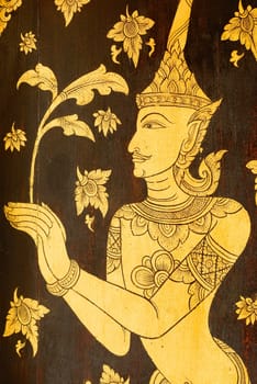 the detail of  thai gold painting pattern on ancient  wood plate,shallow focus,Lampang temple,Thailand