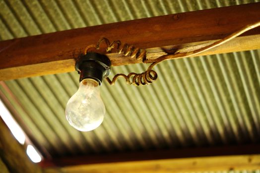 old style lamp in antique wooden house