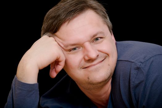 Mature man portrait on black background