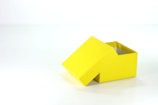 yellow paper box on white scene,shallow focus