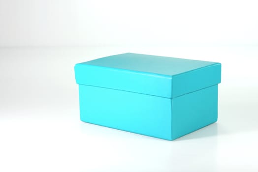 light blue paper box on white scene,shallow focus