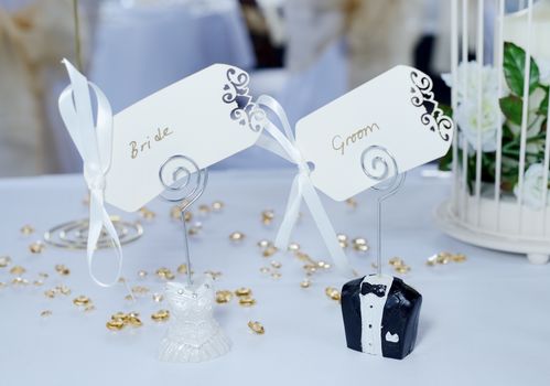 Wedding reception details closeup, bride and groom place cards