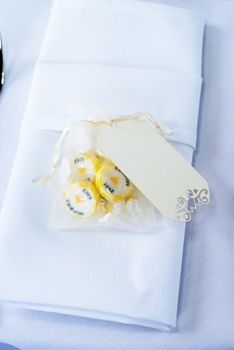 Closeup of wedding reception candy and napkin