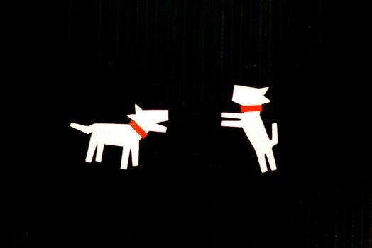 dog character on black scene that made from paper cutting handcraft ,shallow focus